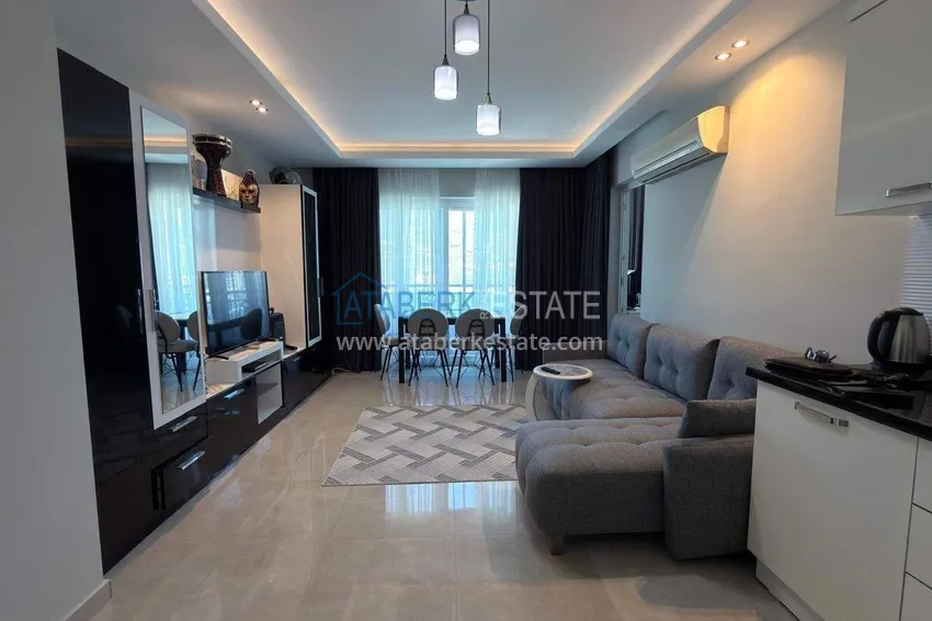 Purchase Apartment 1+1 in the center of Mahmutlar - on the 12th floor with furniture and mountain views 1