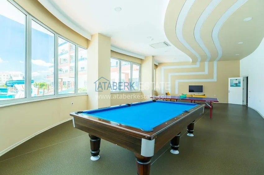 Apartment 1+1 in the center of Mahmutlar - on the 12th floor with furniture and mountain views 15