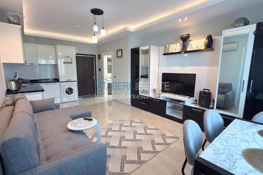 Purchase Apartment 1+1 in the center of Mahmutlar - on the 12th floor with furniture and mountain views 3