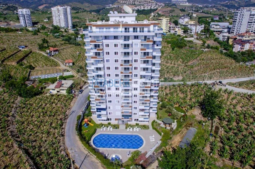 1+1 apartment in Mahmutlar — new furniture, 70 m², glazed balcony, sea and mountain views 1