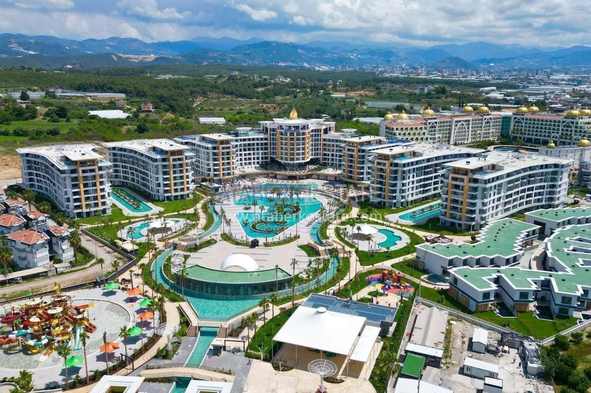 Недвижимость в Алании - квартира 1+1 85 м2 с мебелью в премиальном resort-комплексе, район Тюрклер 1