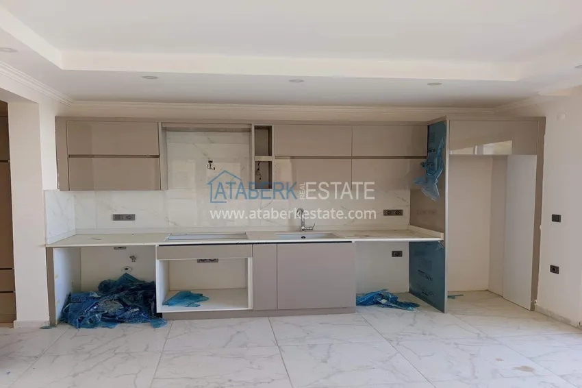 Kupuj Nieruchomość w Alanyi z widokiem na morze - apartament 1+1 w Mahmutlar 3 