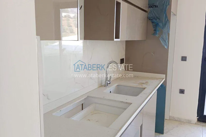 Kupuj Nieruchomość w Alanyi z widokiem na morze - apartament 1+1 w Mahmutlar 4 