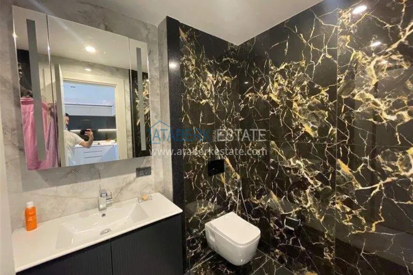 Приобрести Недвижимость в Алании - квартира 1+1 85 м2 с мебелью в премиальном resort-комплексе, район Тюрклер 5