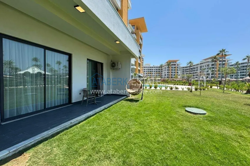 Purchase 2+1 garden duplex in Turkler, Alanya - the format of a private house in a resort residence 1