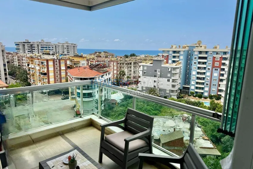 1+1 apartment in Tosmur, 76 m2 with furniture and sea view - property for a residence permit in Alanya 1